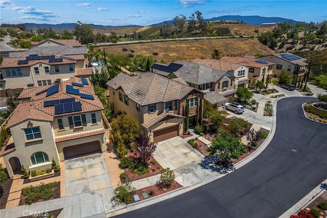 aerial perspective of suburban area with a mountainous background