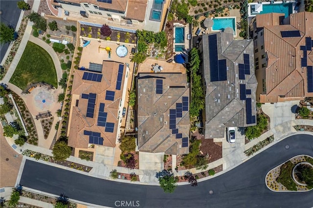 aerial view of property and surrounding area with a pool