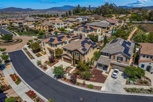 aerial perspective of suburban area with a mountain backdrop
