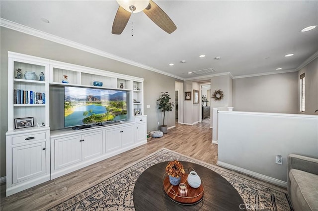 living area with light wood finished floors, recessed lighting, baseboards, ornamental molding, and a ceiling fan