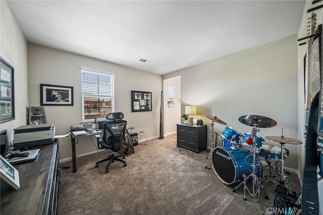 carpeted office space featuring baseboards