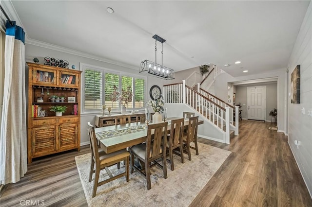 dining space with stairway, wood finished floors, baseboards, recessed lighting, and crown molding