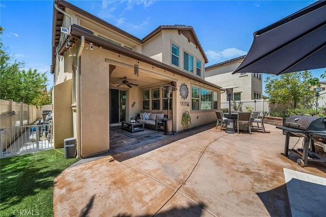 rear view of house featuring outdoor dining area, an outdoor hangout area, stucco siding, and a patio area