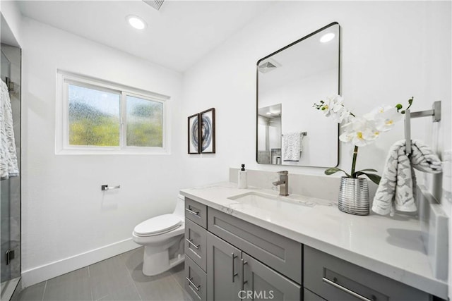 22713 Islamare, Lake Forest, CA 92630 - full bathroom with a shower stall, baseboards, vanity, toilet, and tile patterned flooring