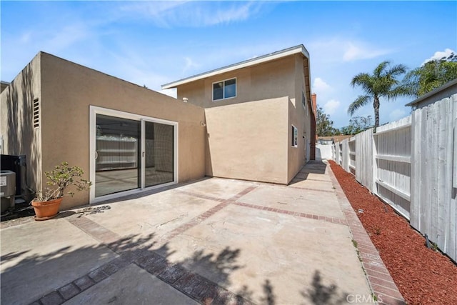 22713 Islamare, Lake Forest, CA 92630 - back of property featuring stucco siding, a fenced backyard, and a patio