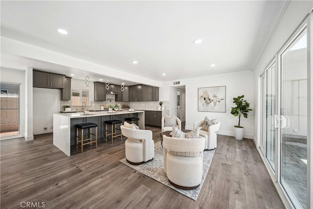 22713 Islamare, Lake Forest, CA 92630 - living area featuring dark wood-type flooring, baseboards, recessed lighting, and plenty of natural light