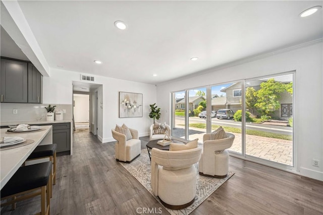 22713 Islamare, Lake Forest, CA 92630 - living area with baseboards, wood finished floors, recessed lighting, and ornamental molding