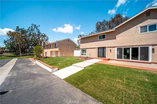 22713 Islamare, Lake Forest, CA 92630 - view of front of home featuring a front yard and stucco siding