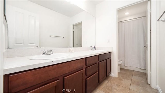 full bath with toilet, double vanity, tile patterned floors, and curtained shower
