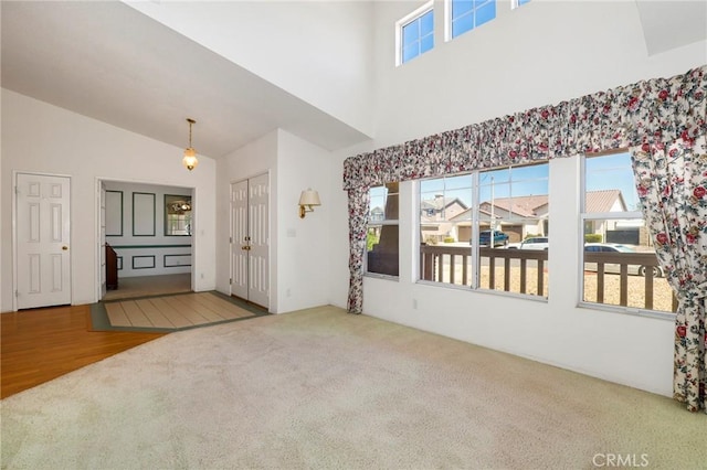 4102 Victoria Ln, Quartz Hill, CA 93536 - spare room featuring carpet flooring, healthy amount of natural light, and high vaulted ceiling
