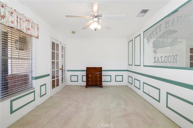 4102 Victoria Ln, Quartz Hill, CA 93536 - carpeted spare room with french doors, wainscoting, ceiling fan, and a decorative wall