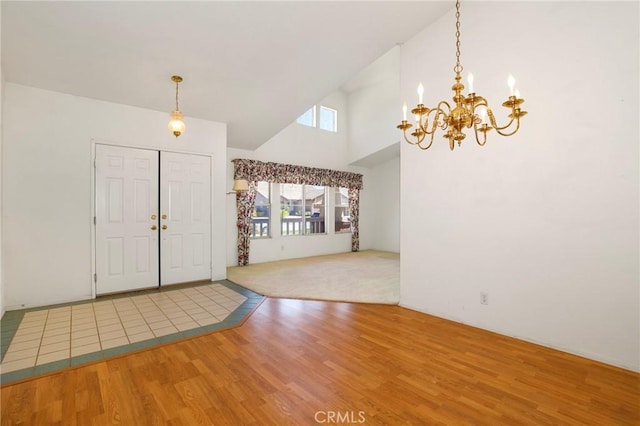 4102 Victoria Ln, Quartz Hill, CA 93536 - foyer entrance featuring wood finished floors, a chandelier, and high vaulted ceiling