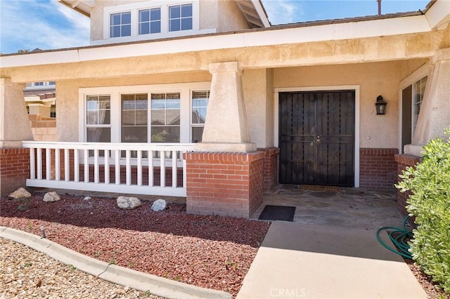 4102 Victoria Ln, Quartz Hill, CA 93536 - doorway to property with brick siding and stucco siding