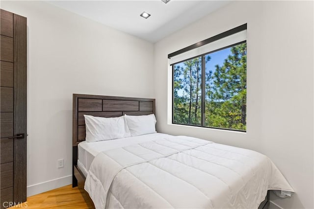 1021 Teakwood Dr, Lake Arrowhead, CA 92352 - bedroom featuring wood finished floors and baseboards