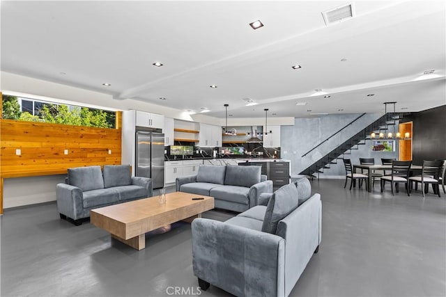 1021 Teakwood Dr, Lake Arrowhead, CA 92352 - living area featuring finished concrete flooring and stairs
