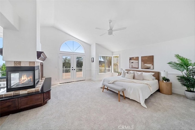 23721 Via Segovia, Murrieta, CA 92562 - bedroom with access to exterior, lofted ceiling, light carpet, a fireplace, and french doors