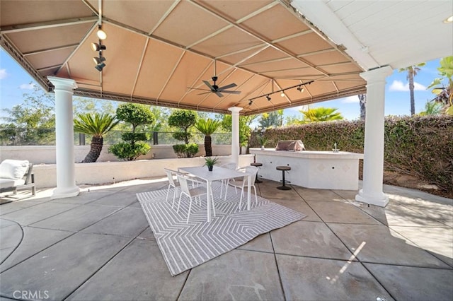 23721 Via Segovia, Murrieta, CA 92562 - view of patio with an outdoor kitchen, a gazebo, a fenced backyard, a ceiling fan, and grilling area