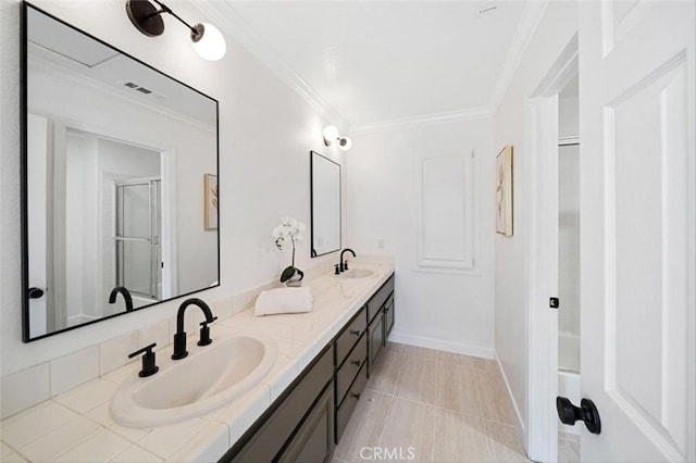 23721 Via Segovia, Murrieta, CA 92562 - bathroom featuring an enclosed shower, double vanity, ornamental molding, and baseboards