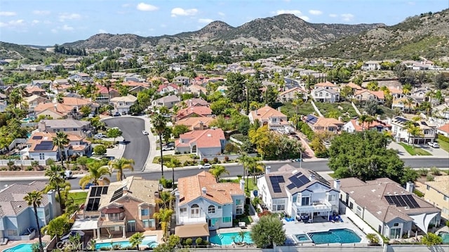 23721 Via Segovia, Murrieta, CA 92562 - aerial perspective of suburban area with a pool area and mountains