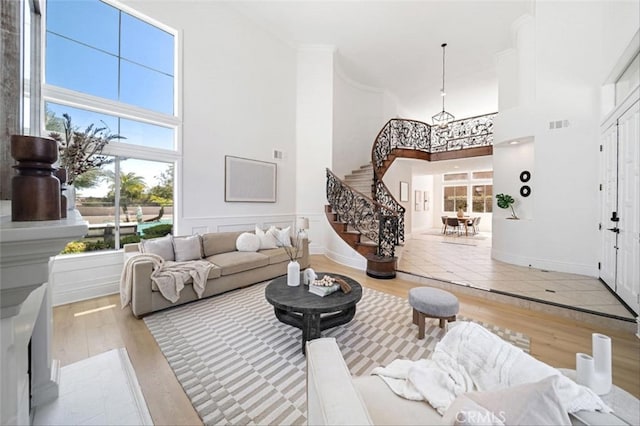 23721 Via Segovia, Murrieta, CA 92562 - living room with a high ceiling, stairs, and wood finished floors