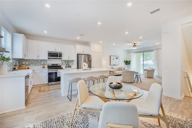 1609 Fig Tree Way, Oceanside, CA 92056 - dining space with recessed lighting, light wood-style floors, a ceiling fan, and baseboards
