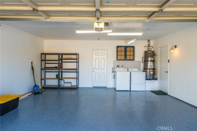 1123 E El Cid E, El Cid, Palm Springs, CA 92262 - garage with washer and clothes dryer, secured water heater, baseboards, and a garage door opener