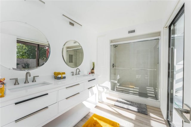 1123 E El Cid E, El Cid, Palm Springs, CA 92262 - full bath with double vanity, toilet, a stall shower, and wood finished floors