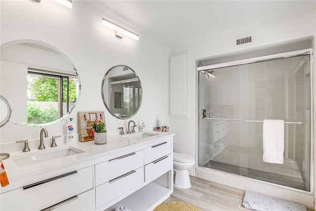 1123 E El Cid E, El Cid, Palm Springs, CA 92262 - full bath featuring toilet, double vanity, a stall shower, and wood finished floors