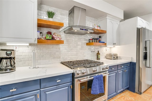1123 E El Cid E, El Cid, Palm Springs, CA 92262 - kitchen with appliances with stainless steel finishes, blue cabinets, and open shelves