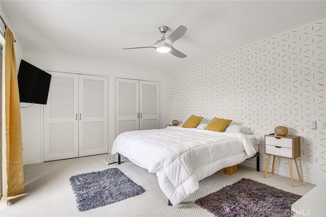1123 E El Cid E, El Cid, Palm Springs, CA 92262 - bedroom with multiple closets, ceiling fan, and carpet flooring