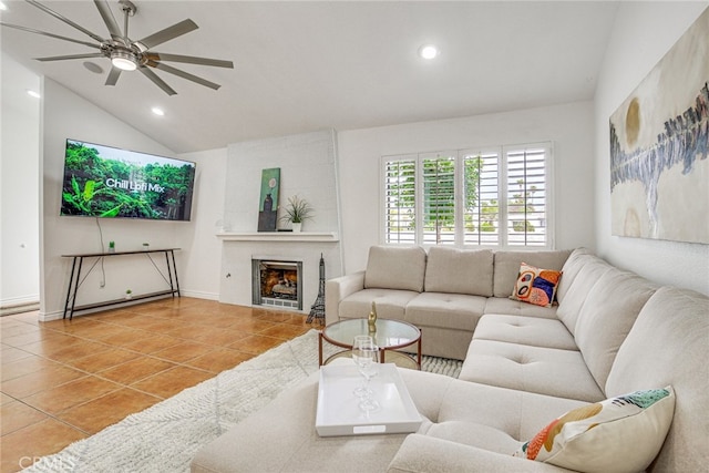 1123 E El Cid E, El Cid, Palm Springs, CA 92262 - tiled living room featuring lofted ceiling, a ceiling fan, recessed lighting, a large fireplace, and baseboards