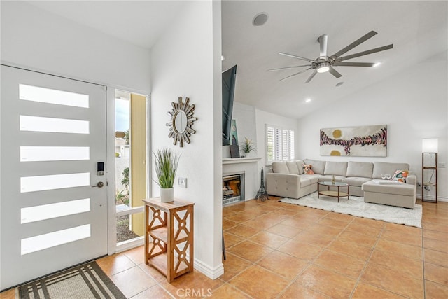 1123 E El Cid E, El Cid, Palm Springs, CA 92262 - entryway featuring light tile patterned flooring, high vaulted ceiling, ceiling fan, and a fireplace