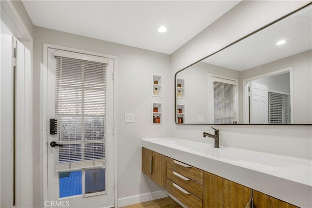 9321 Chapman Ave Unit 2, Garden Grove, CA 92841 - bathroom with vanity, recessed lighting, baseboards, and wood finished floors