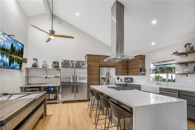 9321 Chapman Ave Unit 2, Garden Grove, CA 92841 - kitchen with island exhaust hood, stainless steel appliances, open shelves, modern cabinets, and a sink