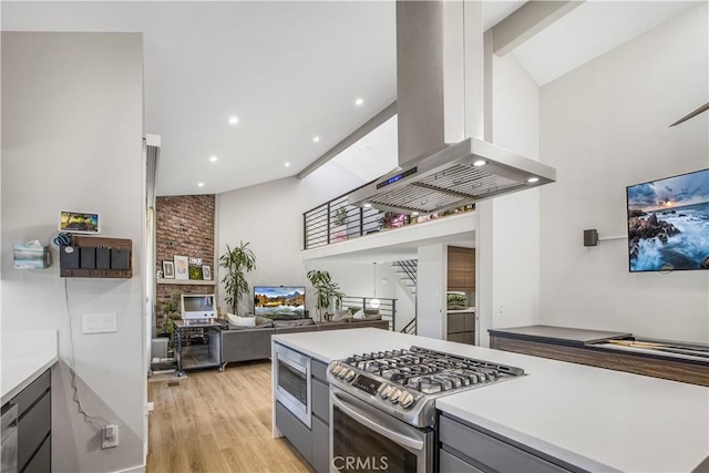 9321 Chapman Ave Unit 2, Garden Grove, CA 92841 - kitchen featuring appliances with stainless steel finishes, island range hood, gray cabinets, high vaulted ceiling, and light wood-style flooring