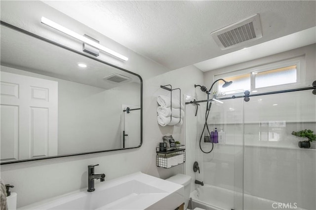 9321 Chapman Ave Unit 2, Garden Grove, CA 92841 - bathroom featuring toilet, vanity, shower / bath combination with glass door, and a textured ceiling