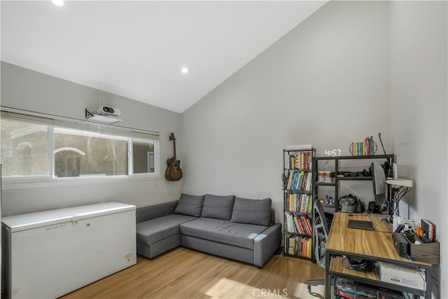 9321 Chapman Ave Unit 2, Garden Grove, CA 92841 - living room with lofted ceiling, wood finished floors, a desk, and recessed lighting
