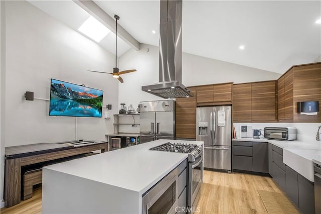 9321 Chapman Ave Unit 2, Garden Grove, CA 92841 - kitchen featuring built in appliances, island exhaust hood, light wood-style flooring, a sink, and light countertops