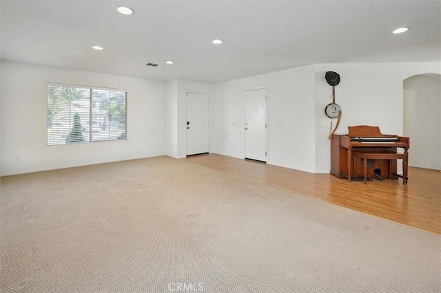 28652 Deer Springs Dr, Saugus, CA 91390 - empty room with recessed lighting, arched walkways, and carpet floors