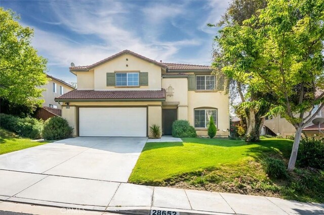 28652 Deer Springs Dr, Saugus, CA 91390 - mediterranean / spanish-style home with an attached garage, concrete driveway, stucco siding, a front lawn, and a tile roof