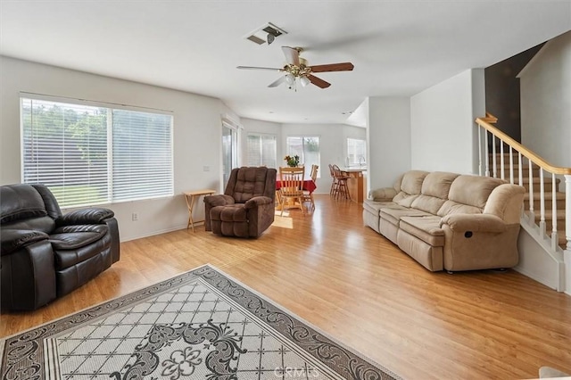 28652 Deer Springs Dr, Saugus, CA 91390 - living area featuring wood finished floors, ceiling fan, stairs, and baseboards