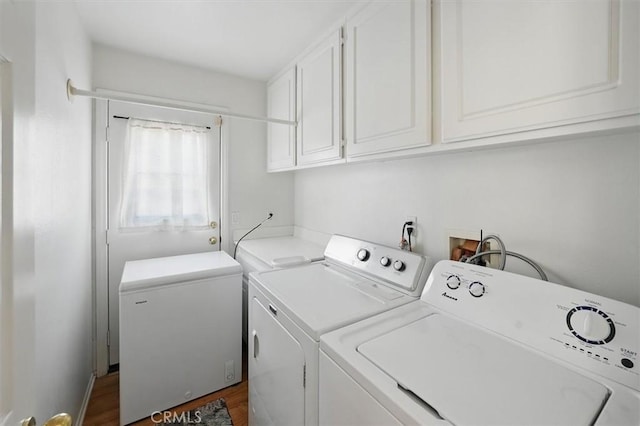 28652 Deer Springs Dr, Saugus, CA 91390 - laundry area featuring cabinet space, washer and dryer, and dark wood-style floors
