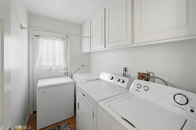 28652 Deer Springs Dr, Saugus, CA 91390 - washroom with cabinet space, independent washer and dryer, and dark wood-style flooring