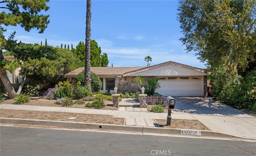 17333 Bronte Pl, Granada Hills, CA 91344 - ranch-style house with an attached garage and concrete driveway