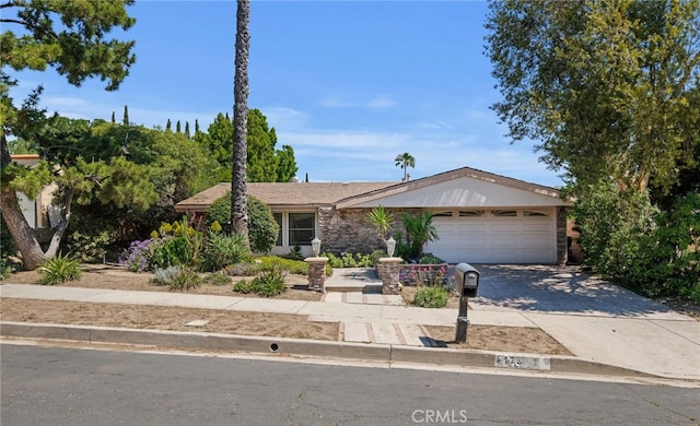 17333 Bronte Pl, Granada Hills, CA 91344 - ranch-style house with an attached garage and concrete driveway