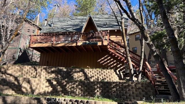 32903 Canyon Dr, Green Valley Lake, CA 92341 - rear view of property with stairway, a wooden deck, and board and batten siding