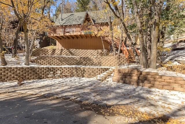 32903 Canyon Dr, Green Valley Lake, CA 92341 - view of home's exterior featuring stairway and a wooden deck