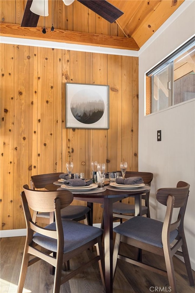 32903 Canyon Dr, Green Valley Lake, CA 92341 - dining space featuring vaulted ceiling, wood walls, wood finished floors, wood ceiling, and baseboards