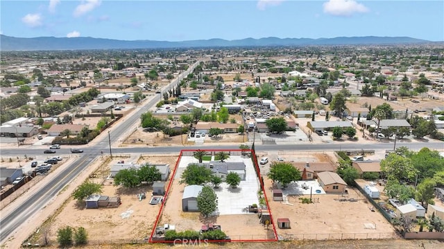 15074 Willow St, Hesperia, CA 92345 - aerial view of residential area featuring a mountainous background and property parcel outlined