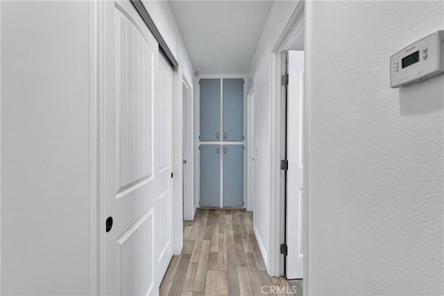 15074 Willow St, Hesperia, CA 92345 - corridor featuring light wood-type flooring